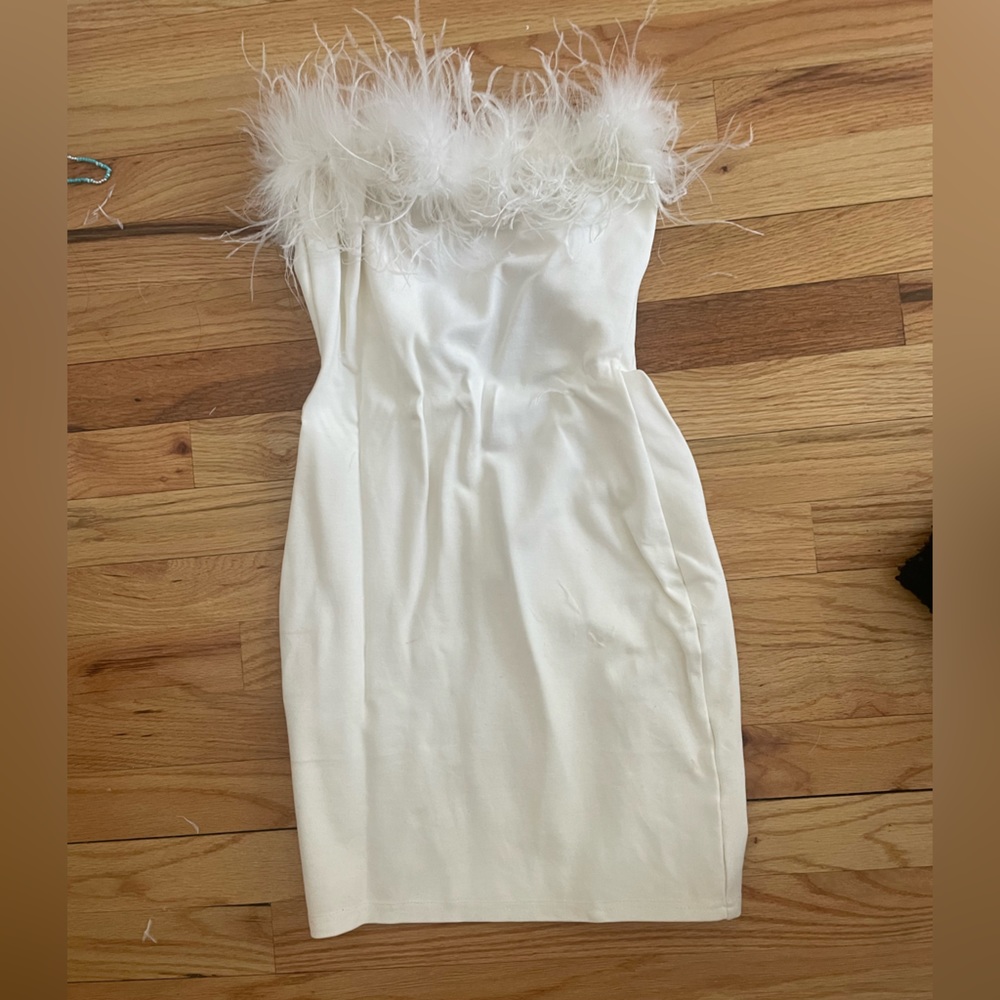 White bodycon dress with feather trim